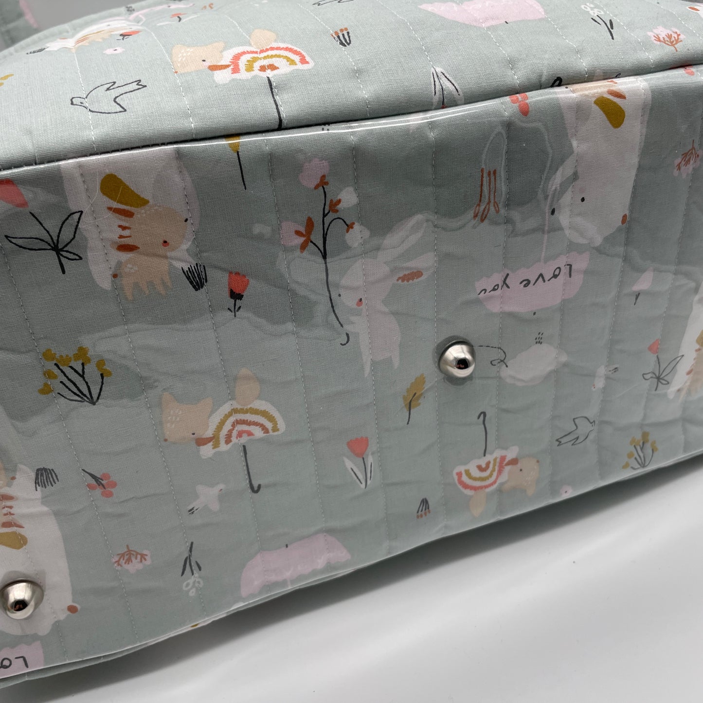 Détail fond sac Boogie, pieds de sacs