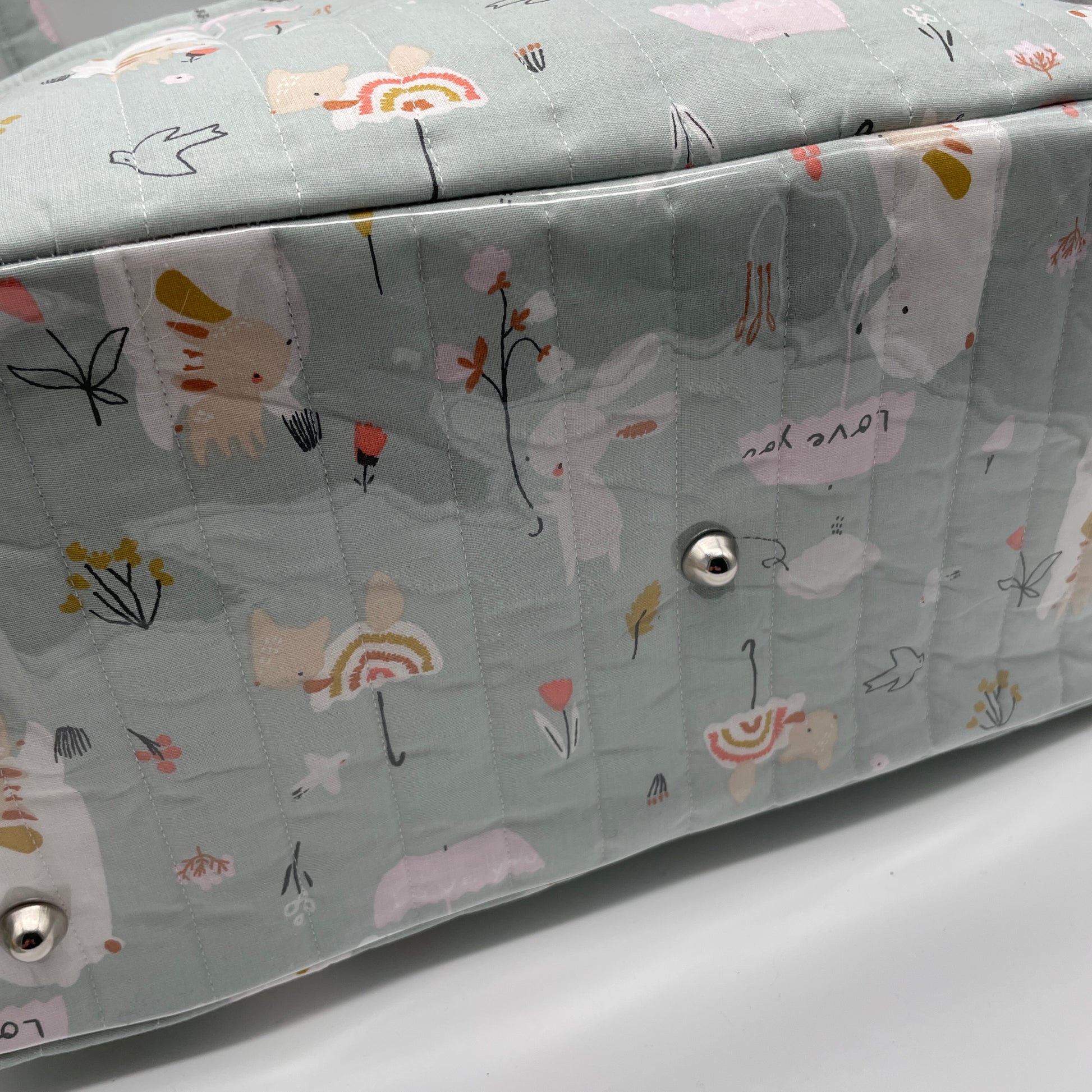 Détail fond sac Boogie, pieds de sacs